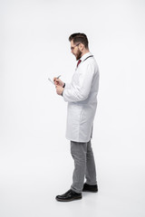 Smiling medical doctor. Isolated over white background.