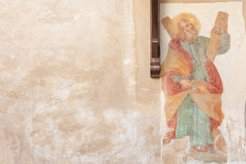 Fresco outside the wall of San Andrea church. It is a Gothic building dating back to the 15th century, with subsequent Baroque additions