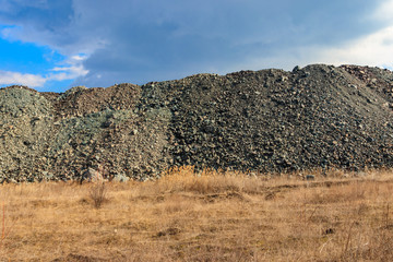 View of slag heaps of iron ore quarry. Mining industry