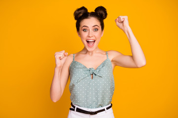 Portrait of astonished positive girl enjoy rejoice lottery fortune win impressed raise fists scream...