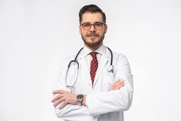 Fototapeta premium Smiling medical doctor. Isolated over white background.