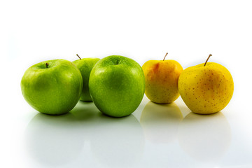 Yellow and green apples isolated on white background