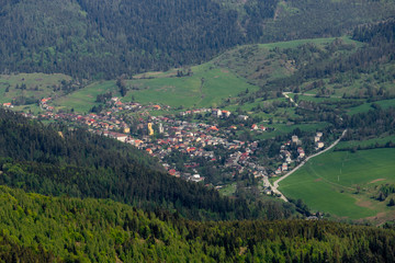 Fototapeta na wymiar Village Smolník, Slovakia from the distance in the valley