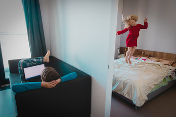 father working from home while child dance and have fun