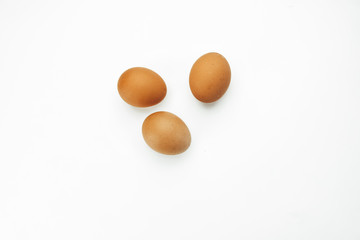
three eggs on a white background
