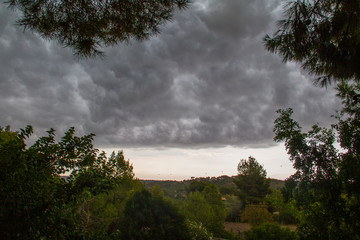A storm begins to form on the outskirts of Valencia