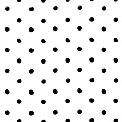 Seamless pattern from abstract round textured black brush strokes on a white background