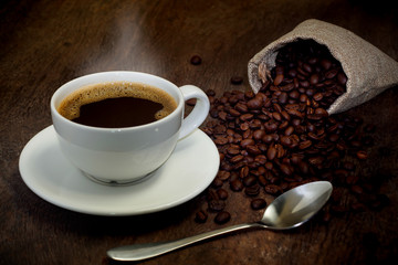 Hot coffee cups and coffee beans