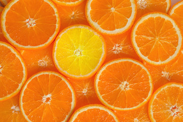 Slices of urgent orange over the table.