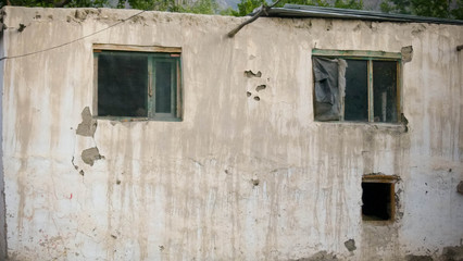 A close up of wall and windows
