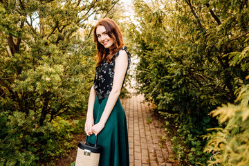 portrait of beautiful young girl in dress in the garden, female portrait outdoors