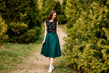 portrait of beautiful young girl in dress in the garden, female portrait outdoors