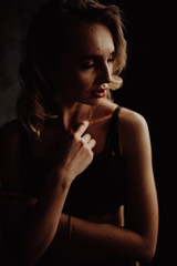 Fototapeta premium Dark portrait of sexy glamour woman wearing in elegant black lingerie