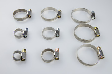 Worm and pipe clamps for construction, different sizes.