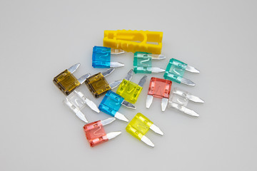 car fuse of different amperes and colors.