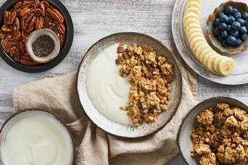 Yogurt with chocolate granola, bilberry. Breakfast, healthy diet food with oat flakes