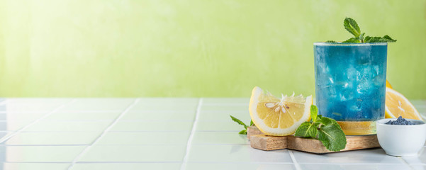 Blue matcha lemonade on white background, copy space