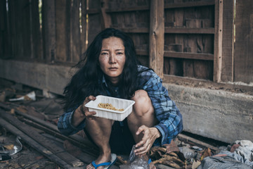poor people,homeless or beggar begging for help sitting at dirty slum.concept for poverty...