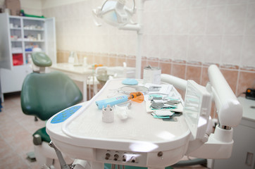 Obraz na płótnie Canvas Dental clinic office with chair. Dental office dentist tools. Medical equipment and dentistry.
