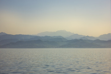 The sea at dawn. Background mrsky landscape. Calm ocean.