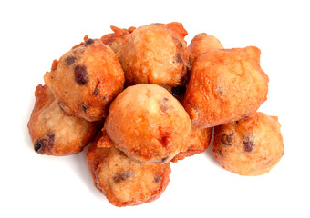 Deep fried doughnut balls also known as typical Dutch oliebollen over white background
