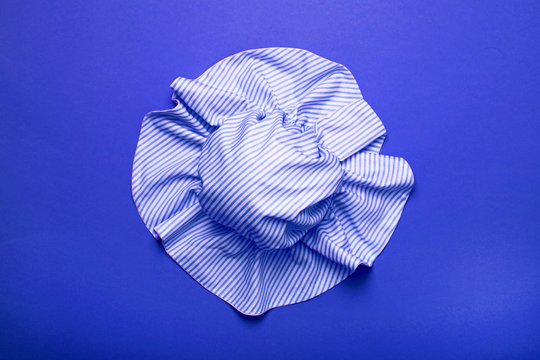 Tender classic blue hat for women, girls or baby on a trendy background. Stylish hat for the beach and travel.