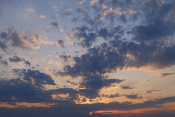 sunset orange sky with blue clouds