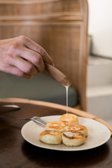 curd cheese on a plate with condensed milk