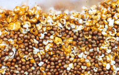 Sweet popcorn behind glass as an abstract background.