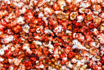 Sweet popcorn behind glass as an abstract background.