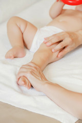 Fototapeta na wymiar Children's professional massage. Elements of a child's massage. Massage for newborn. Baby massage for kids
