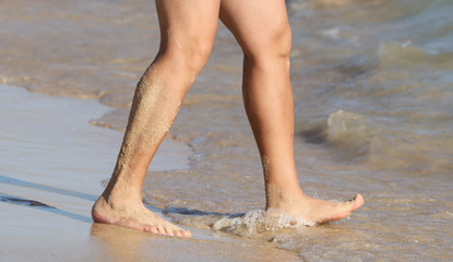 Fototapeta na wymiar A man in swimming trunks on the seashore.