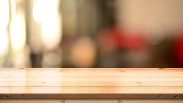 Wooden top table with bokeh light effect and blur restaurant on background