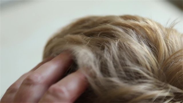woman combing her hair