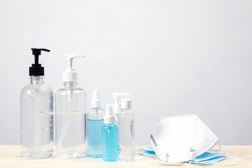 Bottle of hand sanitizer alcohol gel clear liquid plastic pump. antiseptic and mask prevent the...