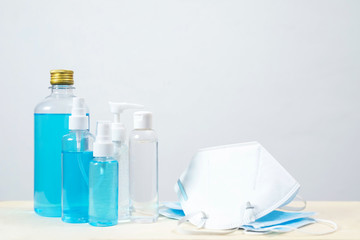 Bottle of hand sanitizer alcohol gel clear liquid plastic pump. antiseptic and mask prevent the spread of germ and bacteria antibacterial hygiene and avoid infection corona virus, covid 19 protection.