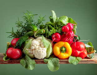 Various fresh raw vegetables, frontal view.