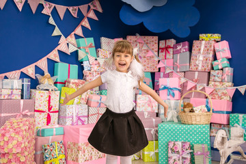 The girl and a lot of boxes with gifts, the joy, the preparation for the holiday, packaging, boxes, lifestyle, holiday, vacation, waiting for santa