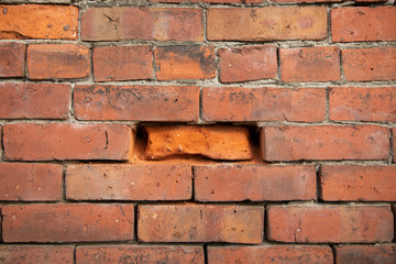 Eroded brick in a masonry wall