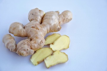 Organic fresh ginger roots on white background with blue light tone