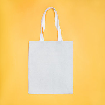 Eco Cotton Tote Bag Mock -up On Yellow Background.