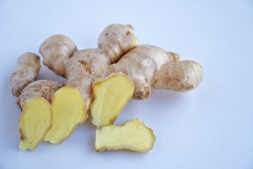 Organic fresh ginger root on white background with blue tone light.