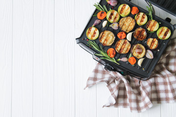 Delicious grilled vegetarian or vegan vegetables top view with copy space. Healthy BBQ table concept