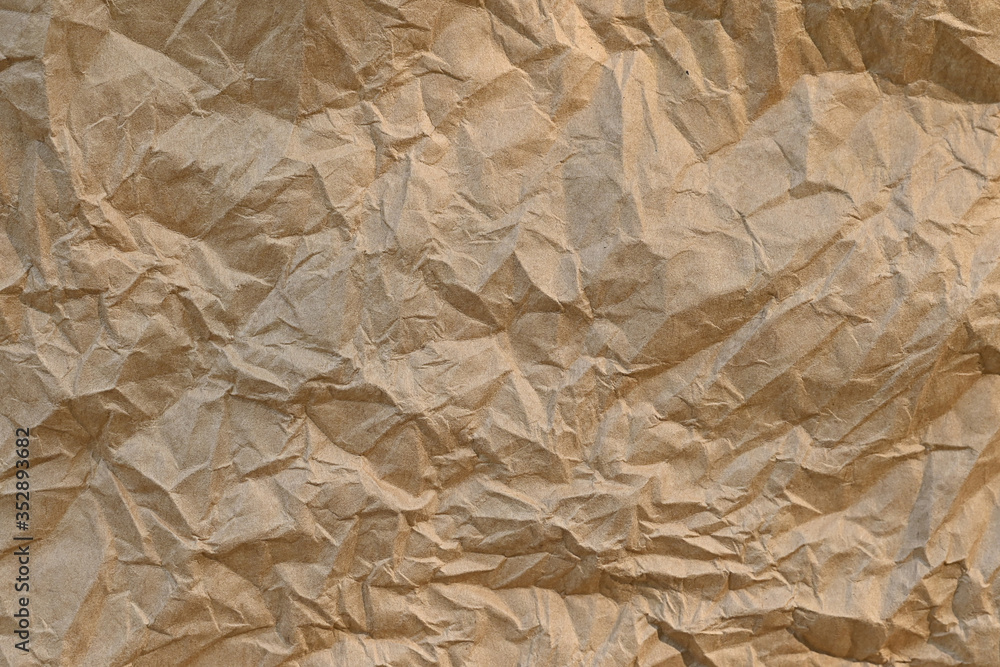 Poster brown crumpled paper texture background sheet of paper ,paper textures are perfect for your creative