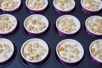 Homemade banana muffins cake with macadamia nut tray - home bakery concept