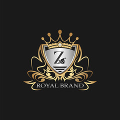 Z Letter Gold Shield Logo. Elegant vector logo badge template with alphabet letter on shield frame ornate vector style  design.