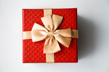 Red box with a big bow. Packing for a gift.