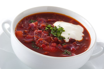 Traditional Ukrainian Russian borsch. Beetroot soup isolated on white background. Close up