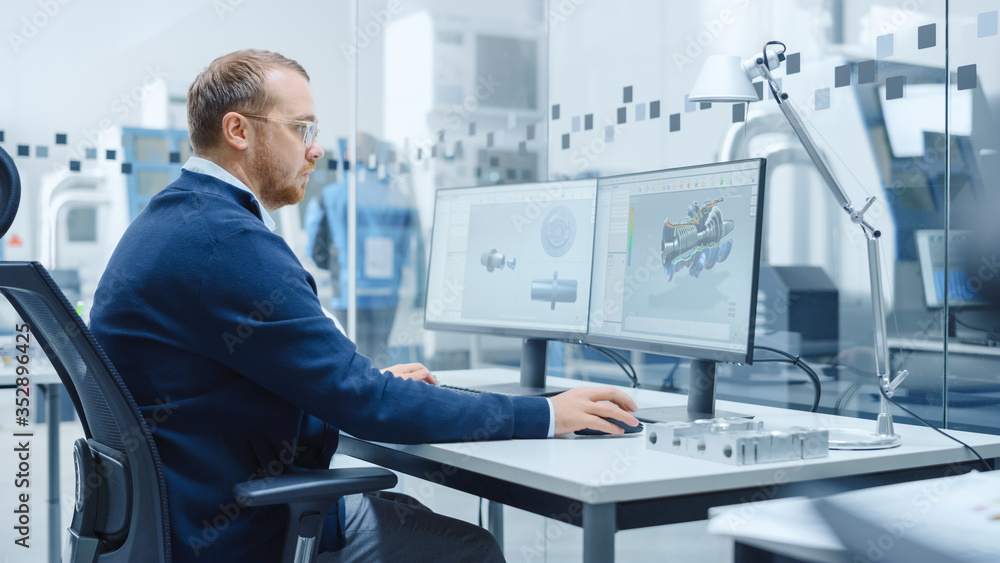Poster Male Industrial Engineer Solving Problems, Working on a Personal Computer, Two Monitor Screens Show CAD Software with 3D Prototype of Hybrid Electric Engine Being Tested. Working Modern Factory