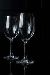 red wine glasses on a black background